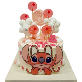 Pink children's cake with Stitch and star sugar lollipops – model F2184.