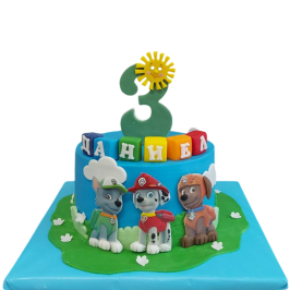 Children's cake "Paw Patrol" F1857 in blue with a green meadow, characters Marshall, Rocky and Zuma,