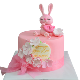 Pink cake F1129 with bunny figurine, flowers and large organza ribbon - cake for a girl.