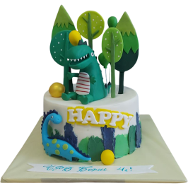 Kids' cake with dinosaurs, forest decoration, trees and the inscription HAPPY, suitable for a birthday.