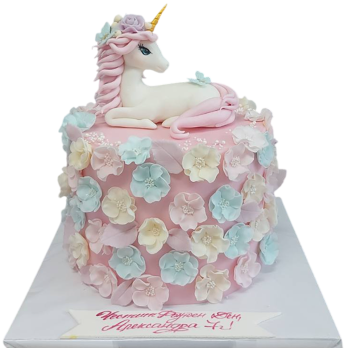 Powder pink children's cake F1771 with a sugar fondant unicorn on top and rich decoration of pastel 3D flowers,